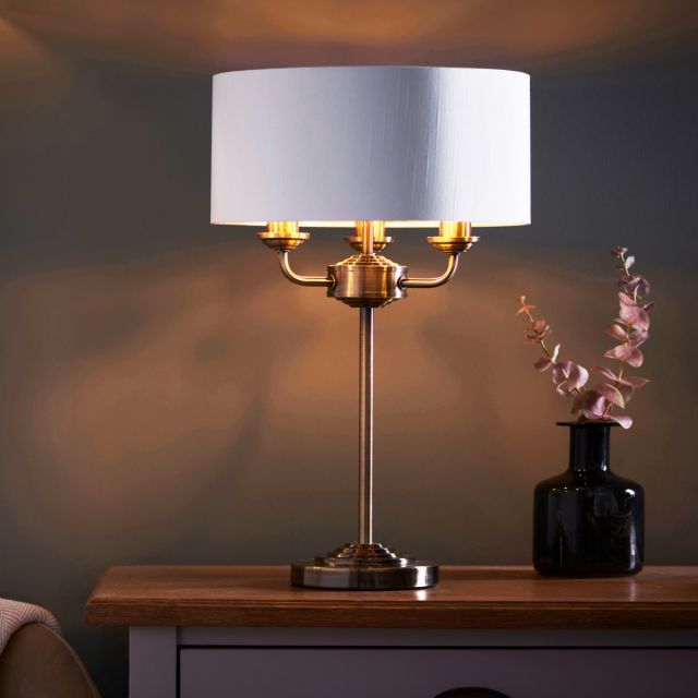 Highclere 3 Light Table Lamp In Antique Brass Finish And Vintage White Fabric Shade